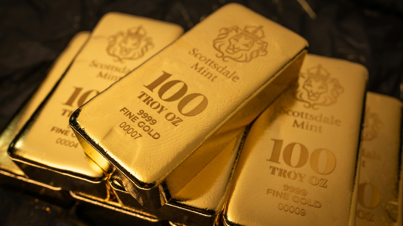 Stack of 100 troy ounce fine gold bars
